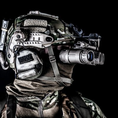 Soldier in night view goggles low key studio shoot